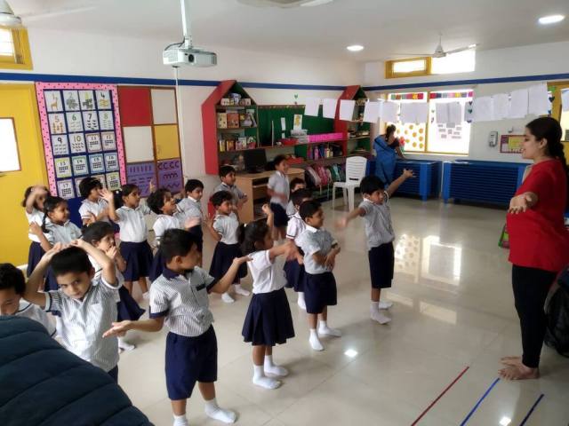 CHIREC students joyfully imitate their teachers' dance steps during a lively and entertaining program.