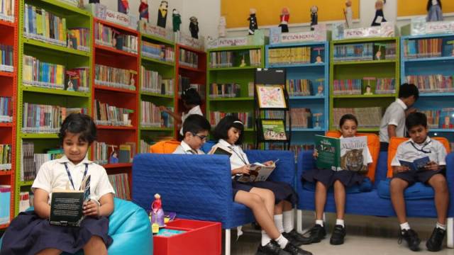 CHIREC students engrossed in reading books at the library.