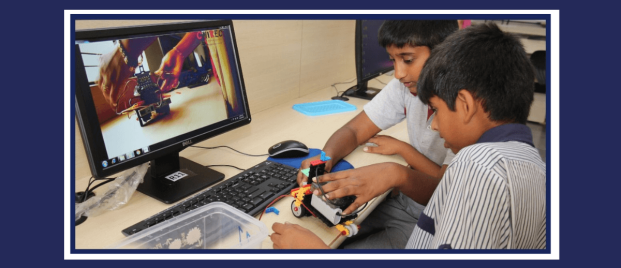 Exploring Robotics CHIREC students learning to use robotics kit while watching tutorial video