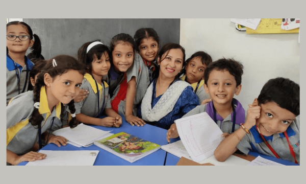 Happy CHIREC teacher and students in classroom