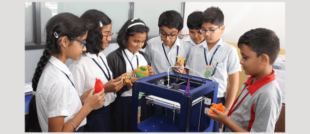 3D printing in Education Students eagerly observing a 3D printing demonstration with excitement and curiosity
