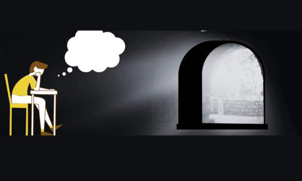 A New Lens To Boredom A student seated in a dimly lit room, lost in contemplation