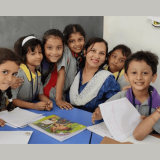 Happy CHIREC teacher and students in classroom