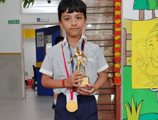 Riyansh receives the Best Striker Award at the Emmanuel Sports Club Football Championship